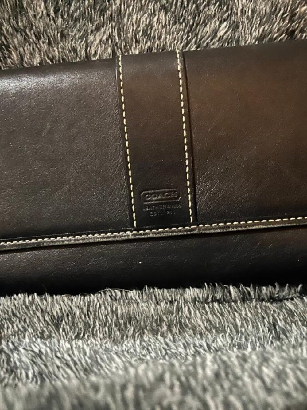 This is a black Coach Hampton wallet